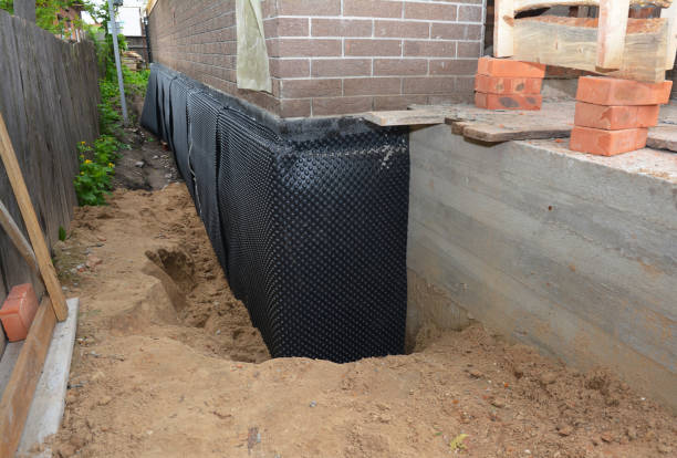 Happy homeowners after waterproofing job in Green Village